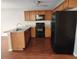 Well-appointed kitchen with wooden cabinets, stainless sink and appliances, and modern countertops at 378 Durmire Dr, Jonesboro, GA 30236