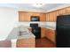 Well-appointed kitchen with wooden cabinets, stainless sink and appliances, and modern countertops at 378 Durmire Dr, Jonesboro, GA 30236