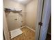 Functional laundry room featuring a utility sink and shelving for organized storage at 378 Durmire Dr, Jonesboro, GA 30236