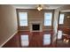 Bright living room featuring hardwood floors, a fireplace, and large windows with natural light at 378 Durmire Dr, Jonesboro, GA 30236