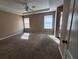 Spacious main bedroom with neutral walls, carpet floors and natural light from two windows at 378 Durmire Dr, Jonesboro, GA 30236