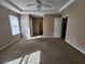 Spacious main bedroom with neutral walls, carpet floors and natural light from one window at 378 Durmire Dr, Jonesboro, GA 30236