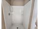 A clean white shower unit featuring built in shelves and bright interiors at 378 Durmire Dr, Jonesboro, GA 30236