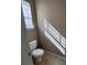 Toilet underneath a window with natural sunlight creates a functional and bright space at 378 Durmire Dr, Jonesboro, GA 30236