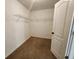 A walk-in closet with sturdy shelving that offers ample storage space at 378 Durmire Dr, Jonesboro, GA 30236