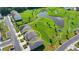 Aerial view of a traditional style two-story home surrounded by lush landscaping and adjacent to community green space at 4583 Roskin St, Duluth, GA 30097