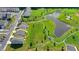 Aerial view of a two-story home with convenient access to a scenic pond, green spaces and community walking trails at 4583 Roskin St, Duluth, GA 30097