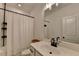 This bathroom includes a shower, a vanity with modern fixtures, and a decorative mirror for a functional space at 4583 Roskin St, Duluth, GA 30097