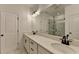 This spacious bathroom includes a large vanity with double sinks and modern fixtures with shower, and sleek design at 4583 Roskin St, Duluth, GA 30097