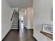 Spacious foyer with hardwood floors and a staircase leading to the upper level of the home at 4583 Roskin St, Duluth, GA 30097