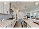 Bright and modern kitchen with white cabinetry, stainless steel appliances, and sleek countertops at 4583 Roskin St, Duluth, GA 30097