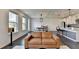 Spacious living room and kitchen with hardwood floors, modern lighting, and a view of the dining area at 4583 Roskin St, Duluth, GA 30097