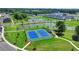 Aerial view of community tennis courts adjacent to a scenic pond and community walking trails at 4583 Roskin St, Duluth, GA 30097