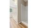 Bathroom with new wood-look floors, a shower, and a separate tub at 658 Slew Ave, Lawrenceville, GA 30043