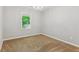 Bedroom with new carpet and a bright window with nature views at 658 Slew Ave, Lawrenceville, GA 30043