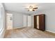 Bedroom with new carpet, closet, a ceiling fan, and neutral paint at 658 Slew Ave, Lawrenceville, GA 30043
