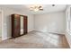 Spacious bedroom with new carpet, closet, and neutral paint at 658 Slew Ave, Lawrenceville, GA 30043