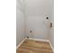 A simple closet featuring wooden floors, white walls, and wiring at 658 Slew Ave, Lawrenceville, GA 30043