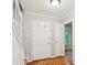 Welcoming foyer with hardwood floors, staircase, and neutral paint at 658 Slew Ave, Lawrenceville, GA 30043