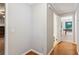 Hallway with wood floors that leads to a room with a pool table at 658 Slew Ave, Lawrenceville, GA 30043