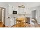 Charming kitchen with white cabinets, stainless steel appliances, and a center island at 658 Slew Ave, Lawrenceville, GA 30043