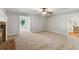 Bright living room featuring a brick fireplace and doorway to another room at 658 Slew Ave, Lawrenceville, GA 30043