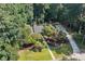 An aerial shot reveals the home's well-manicured yard and driveway at 1590 Sunnybrook Farm Rd, Atlanta, GA 30350