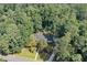 Aerial view of a home surrounded by mature trees, highlighting its peaceful and secluded location at 1590 Sunnybrook Farm Rd, Atlanta, GA 30350