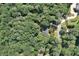 Aerial view of a home surrounded by mature trees, showcasing its quiet location at 1590 Sunnybrook Farm Rd, Atlanta, GA 30350