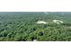 Beautiful tree-lined property offering privacy and convenience near office buildings for an ideal work-life balance at 1590 Sunnybrook Farm Rd, Atlanta, GA 30350