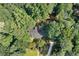 Aerial view of a home nestled among lush trees, showcasing its private and serene setting at 1590 Sunnybrook Farm Rd, Atlanta, GA 30350