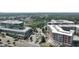 Aerial view showcases a commercial and residential area with modern buildings, streets, parking, and green spaces at 1590 Sunnybrook Farm Rd, Atlanta, GA 30350