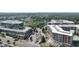 Community aerial view showcasing lush green landscaping, modern buildings and a centralized parking circle at 1590 Sunnybrook Farm Rd, Atlanta, GA 30350