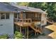 Back of house featuring a large wooden porch with steps at 1590 Sunnybrook Farm Rd, Atlanta, GA 30350