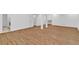 Spacious finished basement area with wood-look flooring and neutral walls at 1590 Sunnybrook Farm Rd, Atlanta, GA 30350