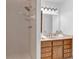 Bathroom features a standing shower with sink vanity, mirror and decorative lighting at 1590 Sunnybrook Farm Rd, Atlanta, GA 30350