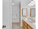 Bathroom with a vanity, framed mirrors and a walk-in shower area at 1590 Sunnybrook Farm Rd, Atlanta, GA 30350