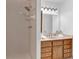 Bathroom featuring a shower stall and vanity with oak cabinets and a large mirror at 1590 Sunnybrook Farm Rd, Atlanta, GA 30350