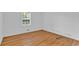 Bedroom features hardwood floors and natural light at 1590 Sunnybrook Farm Rd, Atlanta, GA 30350