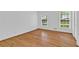 Bright bedroom with hardwood floors and natural light from two windows at 1590 Sunnybrook Farm Rd, Atlanta, GA 30350