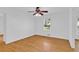 Bedroom featuring hardwood floors, ceiling fan, and natural light at 1590 Sunnybrook Farm Rd, Atlanta, GA 30350