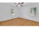 Bedroom features hardwood floors, natural light, and a ceiling fan at 1590 Sunnybrook Farm Rd, Atlanta, GA 30350