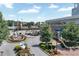 City Springs plaza featuring landscaping, outdoor seating, and accessible parking near the vibrant community center at 1590 Sunnybrook Farm Rd, Atlanta, GA 30350