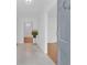Bright, welcoming foyer with marble flooring and views into adjoining rooms with elegant hardwood floors at 1590 Sunnybrook Farm Rd, Atlanta, GA 30350