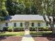 Charming single-story home featuring manicured landscaping, a well-maintained lawn, and a welcoming entrance at 1590 Sunnybrook Farm Rd, Atlanta, GA 30350