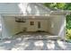 Open garage space with white walls, sink, overhead storage, and natural light at 1590 Sunnybrook Farm Rd, Atlanta, GA 30350