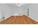 Spacious room features hardwood flooring and white trim, providing a versatile space for living and entertaining at 1590 Sunnybrook Farm Rd, Atlanta, GA 30350