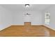Sunlit living room featuring hardwood flooring and a view into the next room at 1590 Sunnybrook Farm Rd, Atlanta, GA 30350