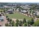 Aerial view of a large green lawn, surrounded by trees and walkways, perfect for community gatherings at 1590 Sunnybrook Farm Rd, Atlanta, GA 30350
