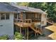 A rear exterior view showcases the home's deck and screened porch at 1590 Sunnybrook Farm Rd, Atlanta, GA 30350